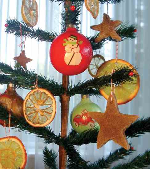 Our tree shines with these paper globe and scented cookie decorations.